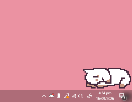 Binky napping on the Windows taskbar